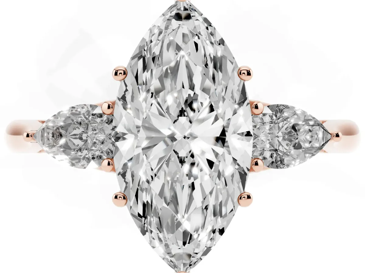 Three-Stone Marquise Cut Diamond Ring with Pear Side Stones in Four-Prong Setting Rose gold