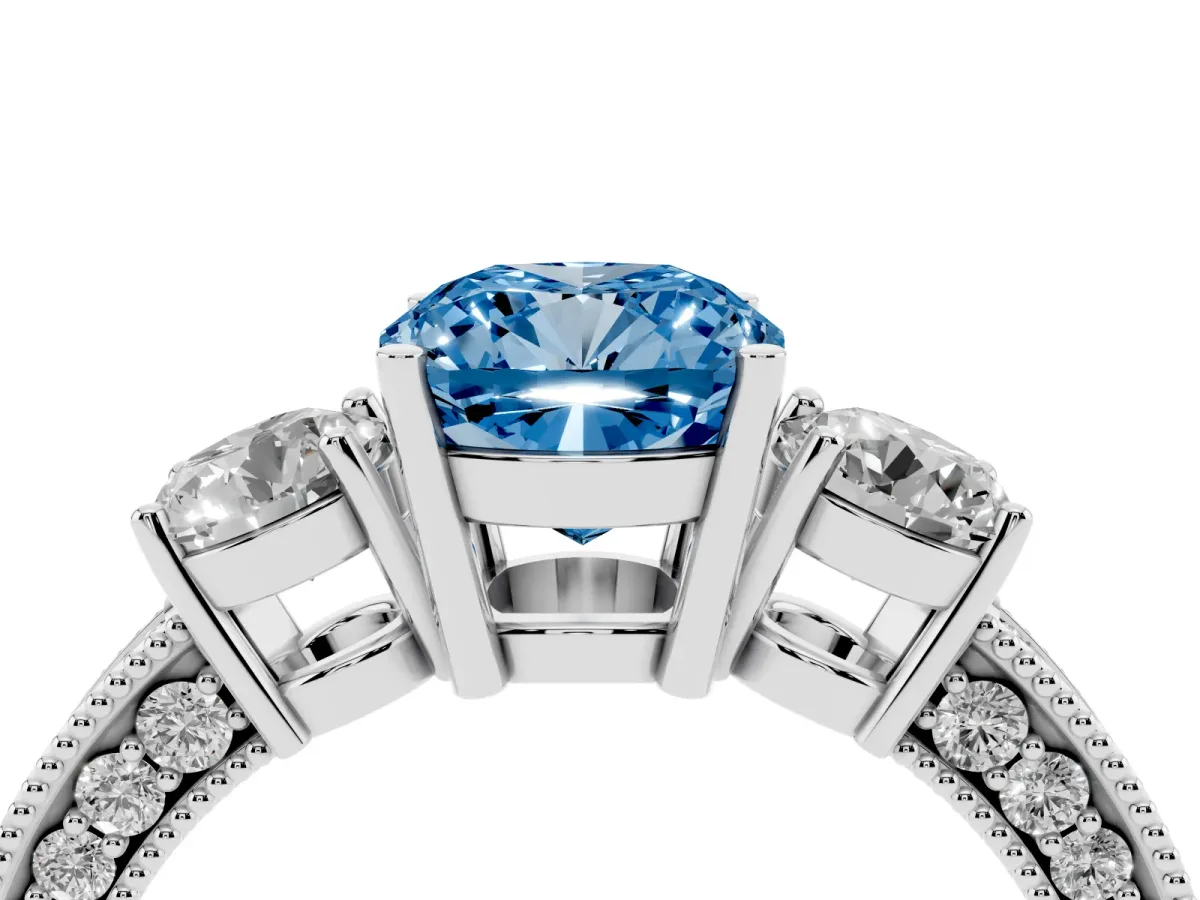 Fancy Blue Cushion Cut Three-Stone Diamond Ring with Pavé Band and Four-Prong Setting Silver