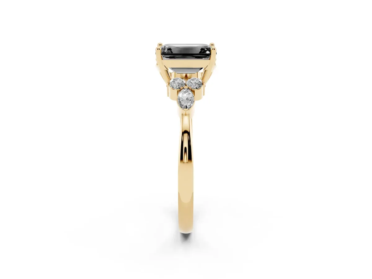 Fancy Black Emerald Cut Brilliant Diamond Solitaire Ring with Pear Side Stones and Four-Prong Setting Yellow gold