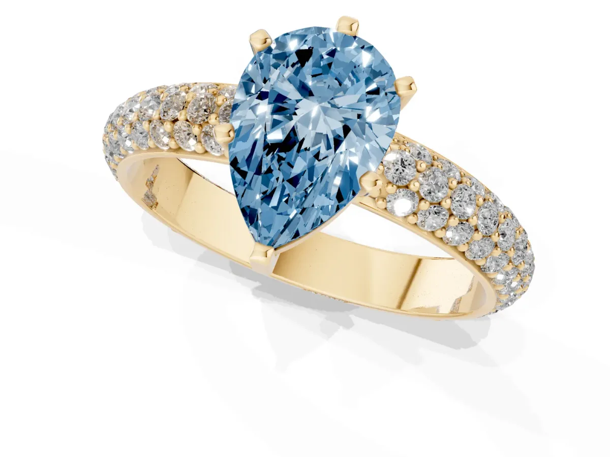Fancy Blue Pear Cut Diamond Solitaire Ring with Prong Setting and Pavé Band Yellow gold