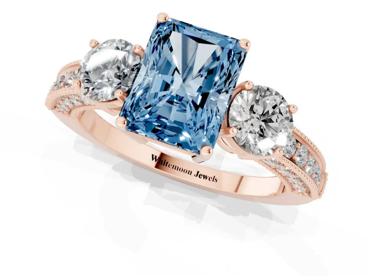 Fancy Blue Radiant Cut Three-Stone Diamond Ring with Pavé Band and Four-Prong Setting Rose gold