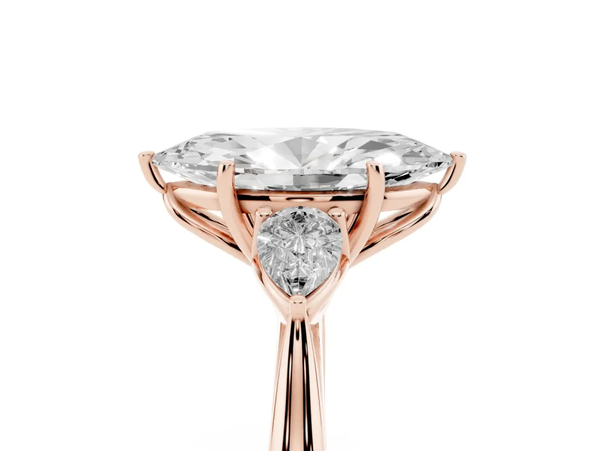 Three-Stone Marquise Cut Diamond Ring with Pear Side Stones in Four-Prong Setting Rose gold