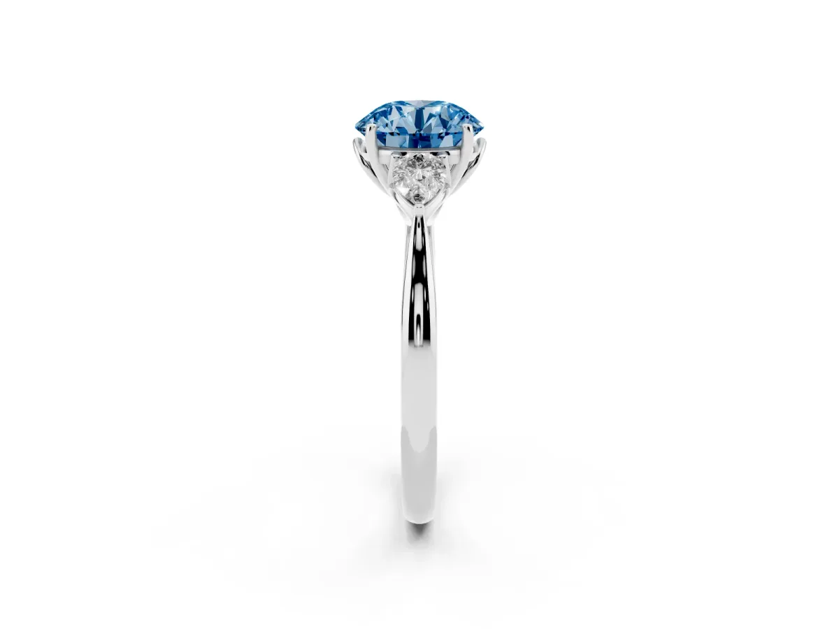 Fancy Blue Round Cut Diamond Three-Stone Ring with Pear Side Stones and Prong Setting Platinum