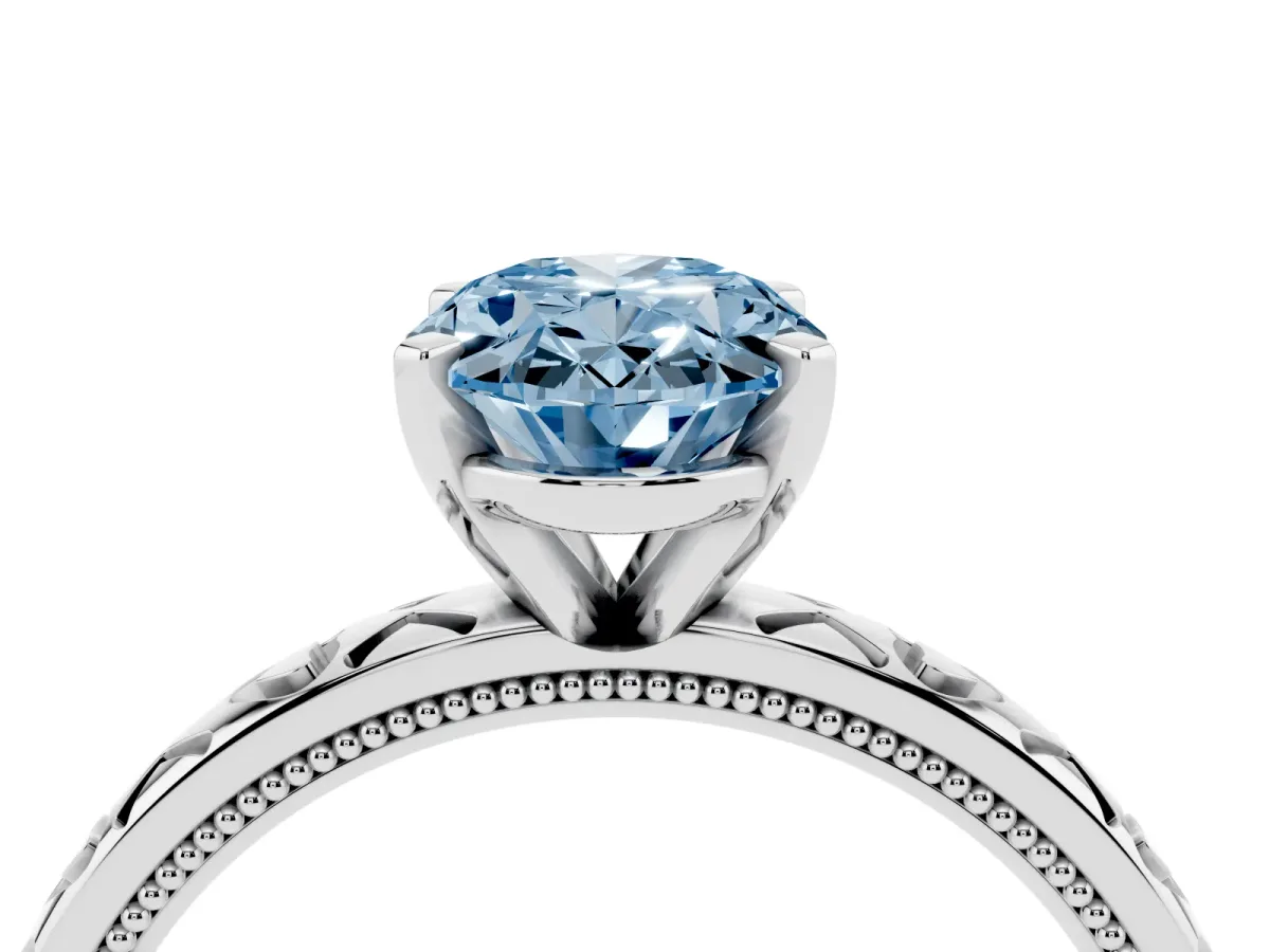 Fancy Blue Oval Cut Solitaire Diamond Engagement Ring with XO Engraved Band and Four-Prong Setting Silver