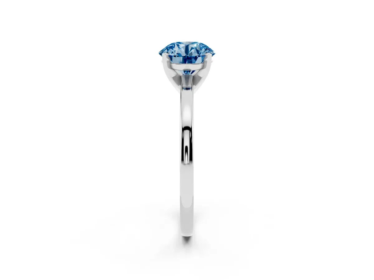 Fancy Blue Round Cut Solitaire Diamond Engagement Ring with Four-Prong Setting on a Classic Band Silver