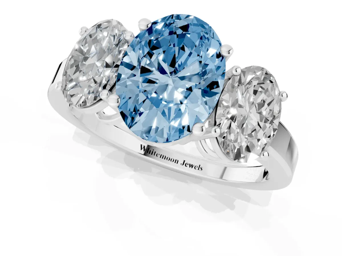 Fancy Blue Three-Stone Oval Cut Cut Diamond Engagement Ring with Flat Band and Four-Prong Setting Silver