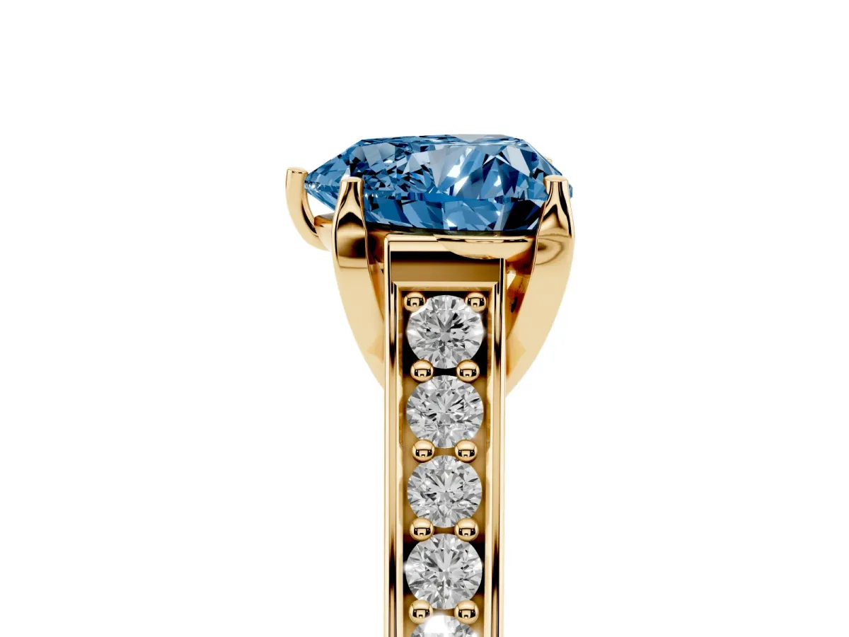 Fancy Blue Heart Cut Brilliant Cut Diamond Engagement Ring with Pavé Band and Four-Prong Setting Yellow gold