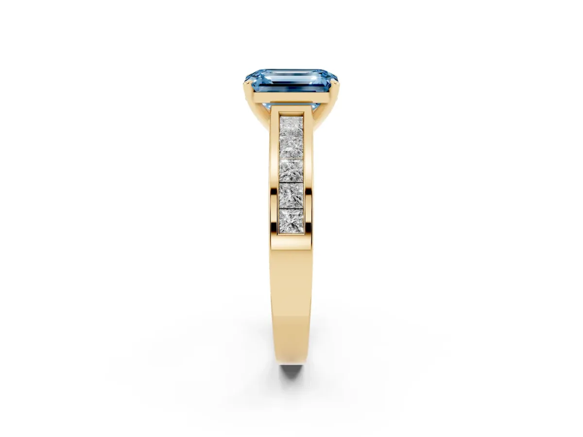 Fancy Blue Emerald Cut Solitaire Diamond Ring with Channel-Set Band and Four-Prong Setting Yellow gold