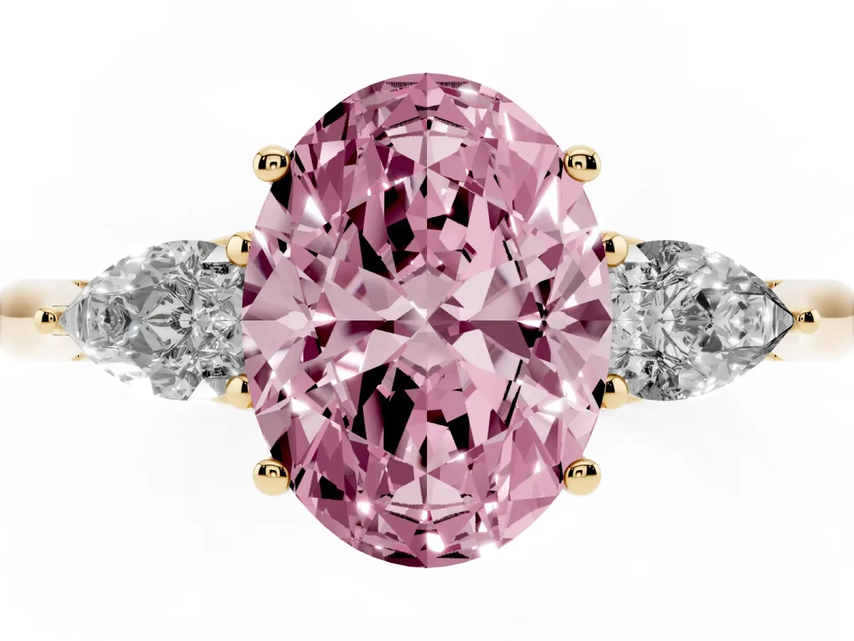 Fancy Pink Three-Stone Oval Cut Diamond Ring with Pear Side Stones in Four-Prong Setting Yellow gold