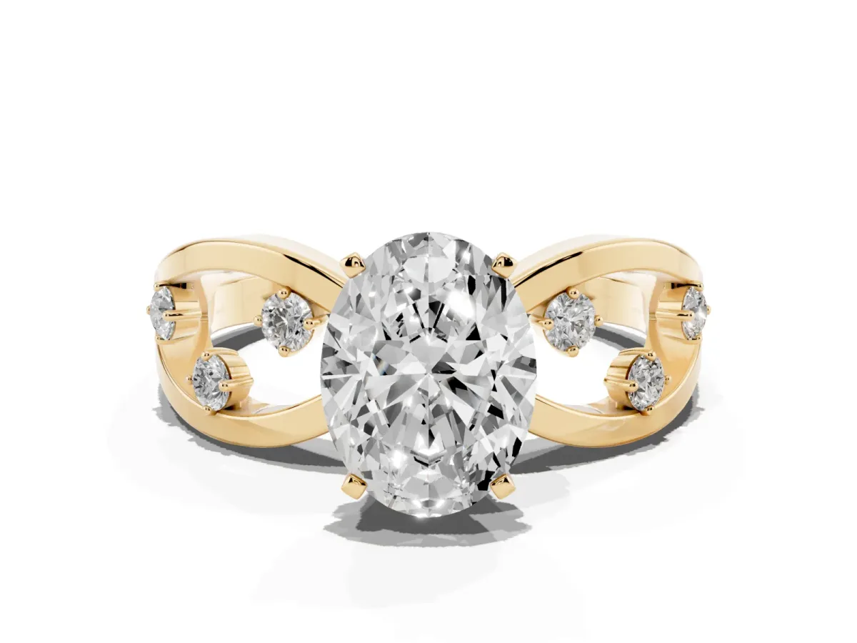 Oval Cut Cut Solitaire Diamond with Side Stones on Criss-Cross Band and Four-Prong Setting Yellow gold