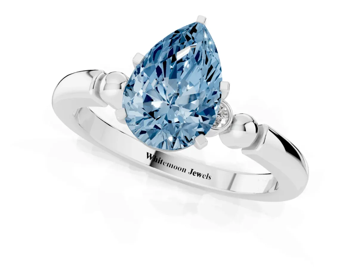 Fancy Blue Pear Cut Solitaire Beaded Band with Four-Prong Setting Silver