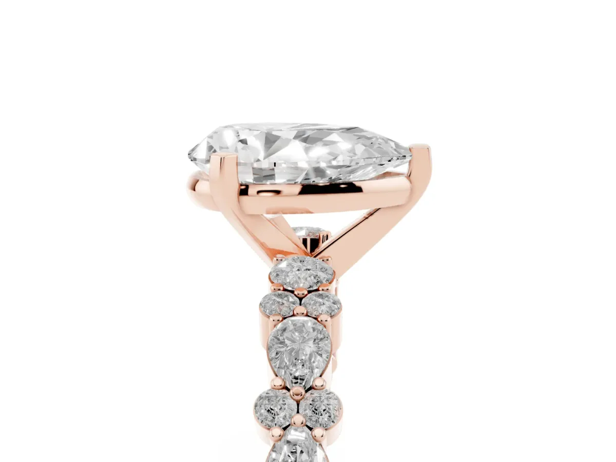 Pear Cut Diamond Side Stone Solitaire Ring with Round and Four-Prong Setting Rose gold