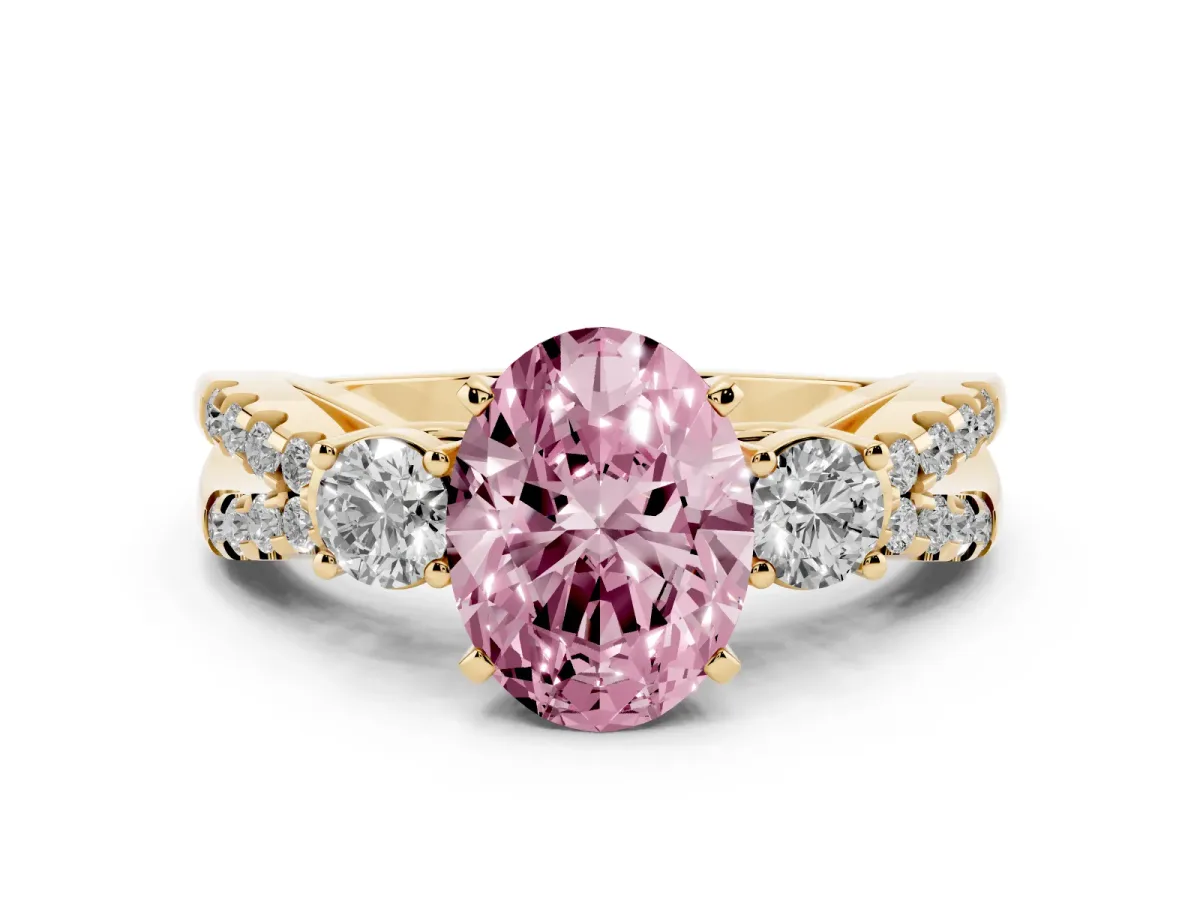 Fancy Pink Oval Cut Diamond Three-Stone Ring with Pavé Split Shank and Four-Prong Setting Yellow gold