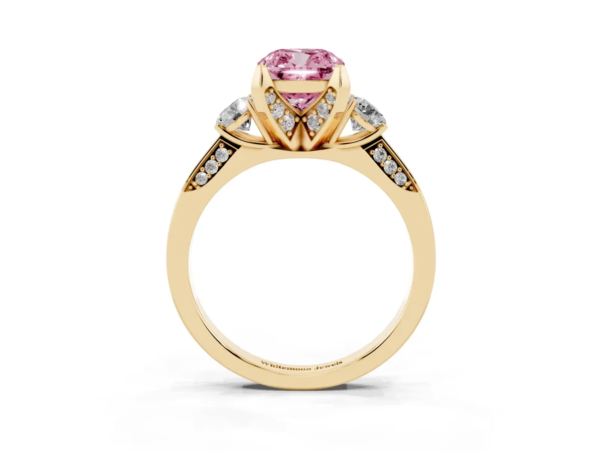 Fancy Pink Cushion Cut Brilliant Three-Stone Diamond Ring with Pavé Band and Four-Prong Setting Yellow gold