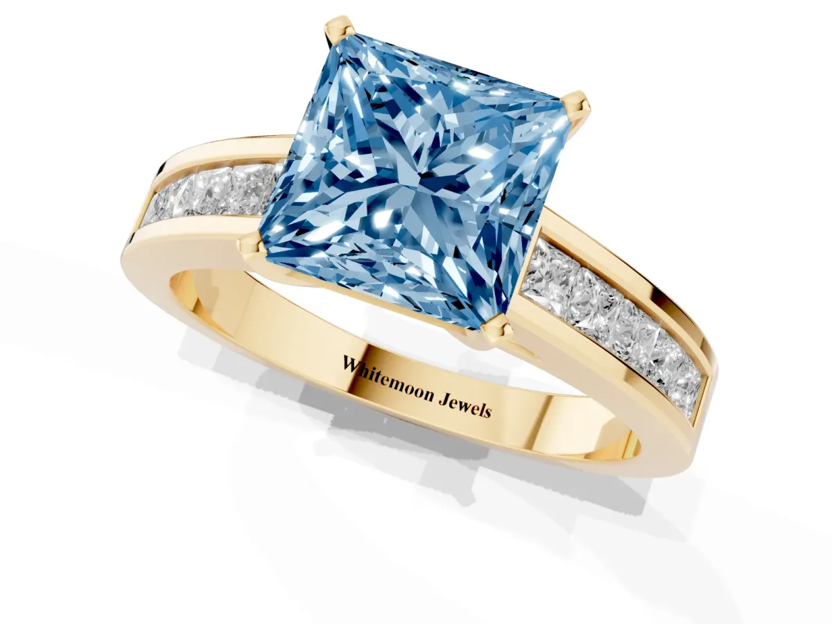 Fancy Blue Princess Cut Solitaire Diamond Ring with Channel-Set Band and Four-Prong Setting Yellow gold