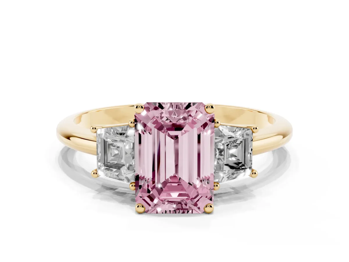 Fancy Pink Emerald Cut Diamond Three-Stone Ring with Trapezoid Side Stones and Prong Setting Yellow gold