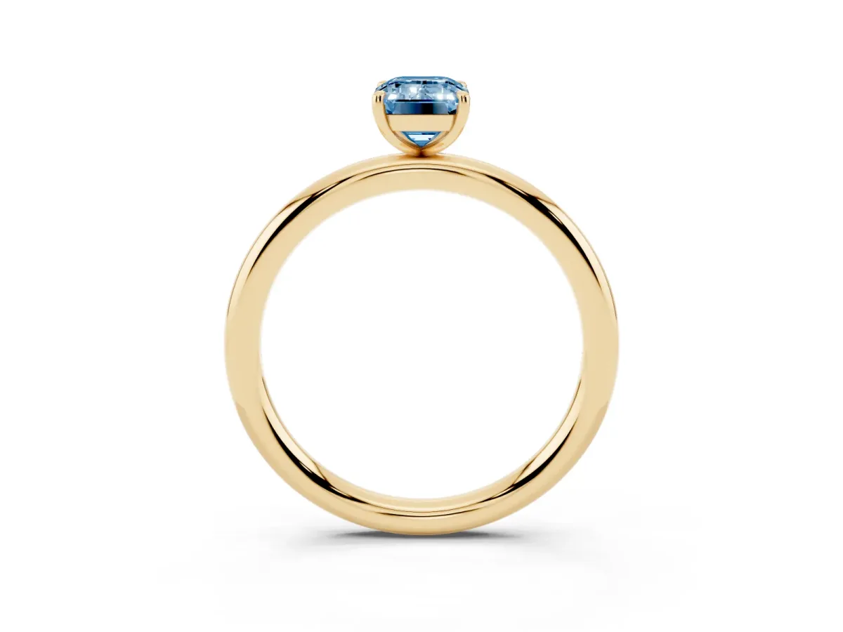 Fancy Blue Emerald Cut Solitaire Diamond Ring with Four-Prong Setting on a Plain Band Yellow gold