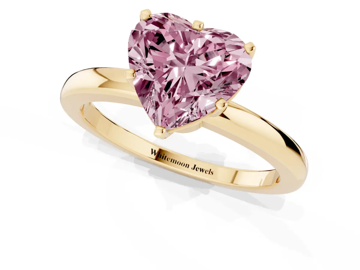Fancy Pink Heart Cut Solitaire Diamond Ring with Six-Prong Setting on a Classic Band Yellow gold