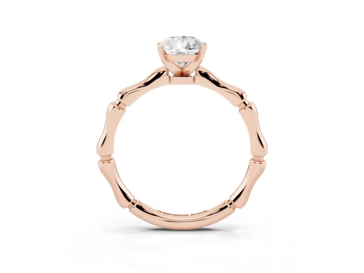 Pear Cut Solitaire Diamond Ring with Bamboo Band and Four-Prong Setting Rose gold