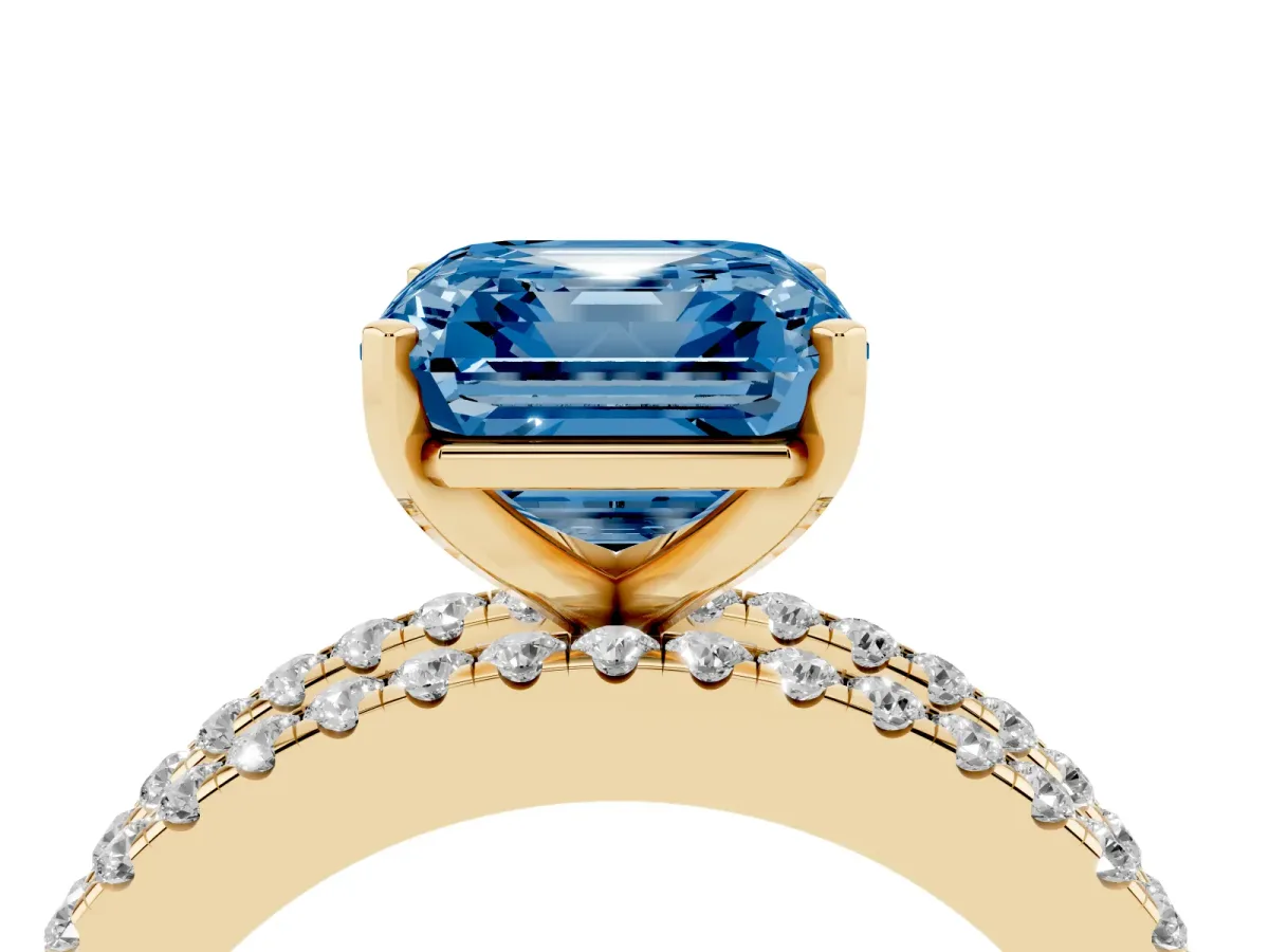 Fancy Blue Asscher Cut Diamond Solitaire Ring with Pavé and Channel Set Band Yellow gold