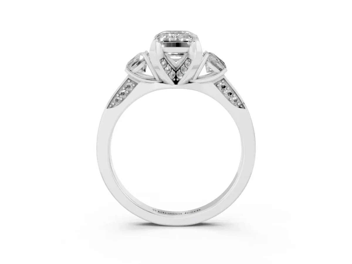 Fancy Pink Emerald Cut Brilliant Three-Stone Diamond Ring with Pavé Band and Four-Prong Setting White gold
