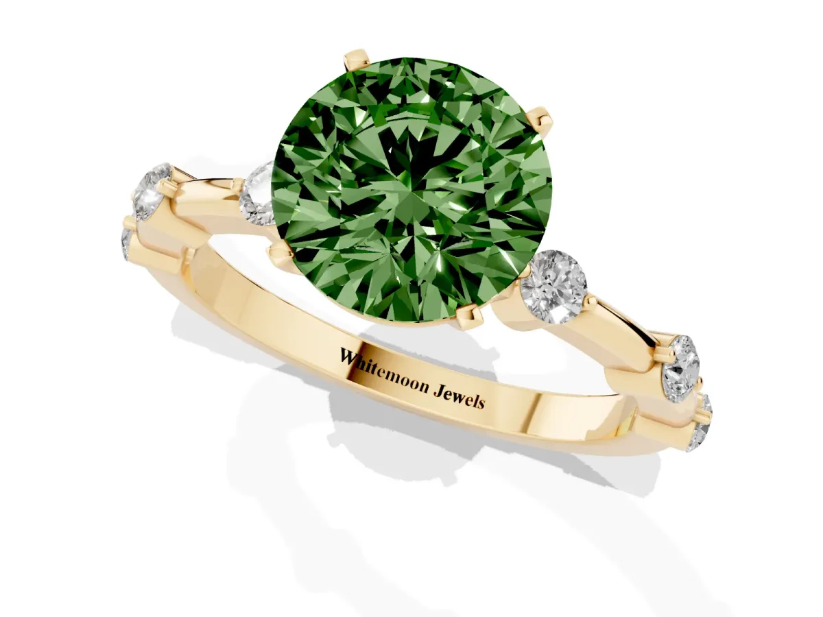Fancy Green Round Cut Solitaire Diamond Ring with Bezel Set Side Stones and Prong Setting Yellow gold