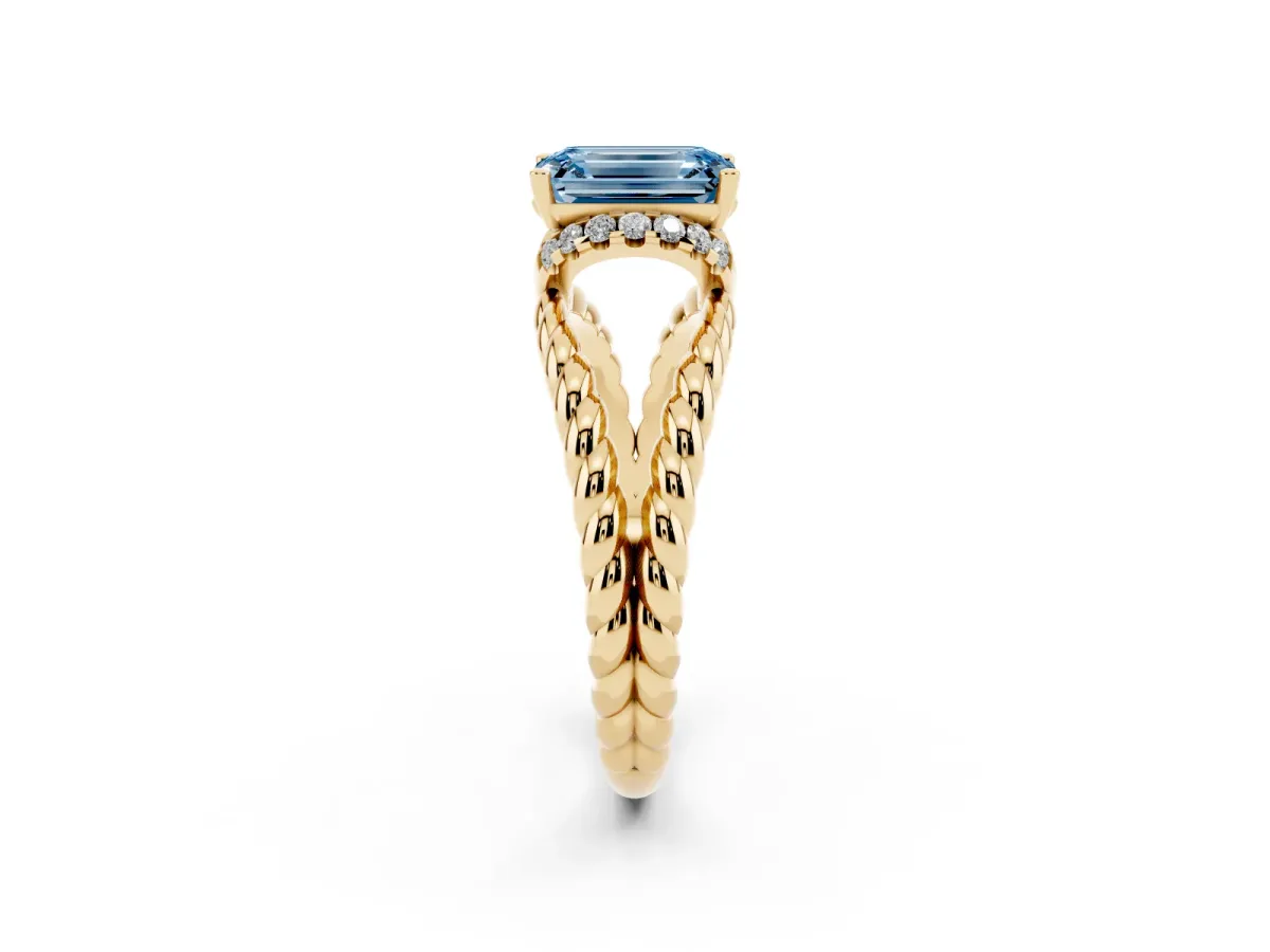 Fancy Blue Emerald Cut Halo Twisted Band Four-Prong Ring Yellow gold