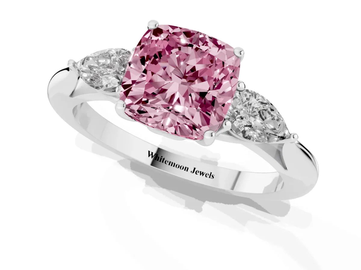 Fancy Pink Three-Stone Cushion Cut Diamond Ring with Pear Side Stones in Four-Prong Setting Platinum