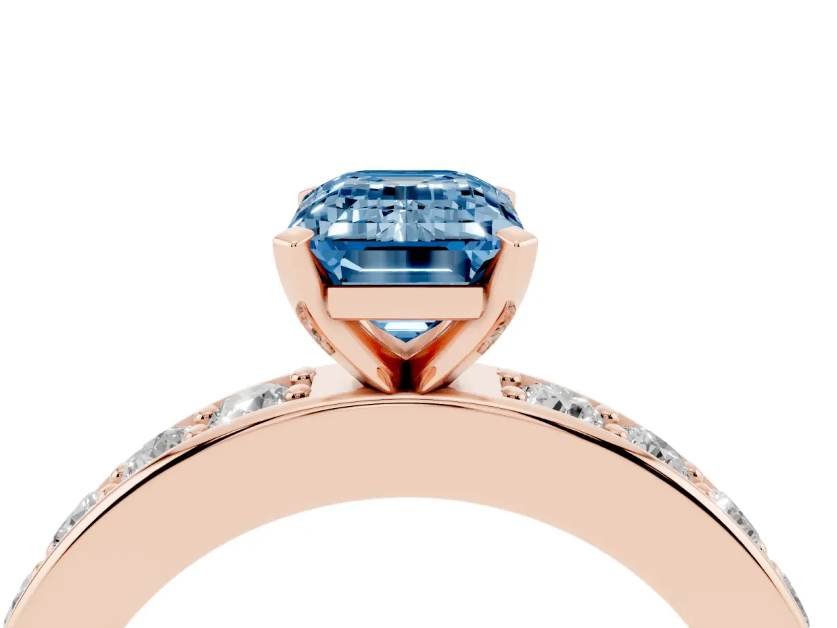 Fancy Blue Emerald Cut Diamond Engagement Ring with Channel Set Round Band and Prong Setting Rose gold