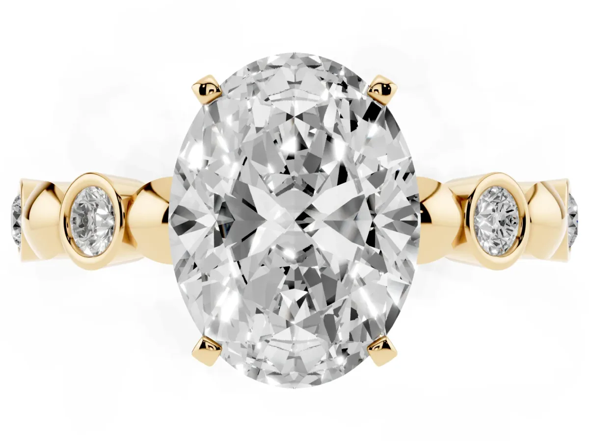 Oval Cut Solitaire Bezel-Set Diamond Ring with Beaded Band and Four-Prong Setting Yellow gold