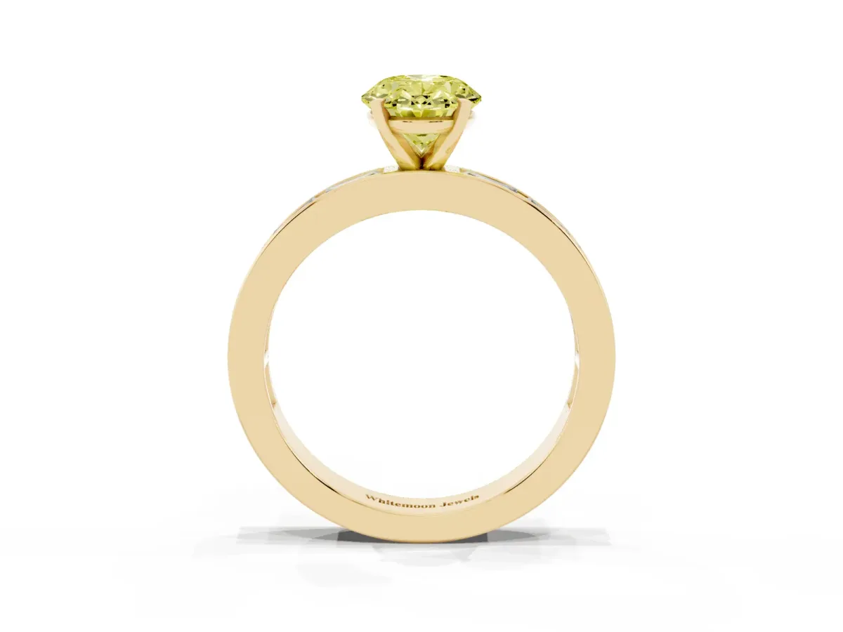 Fancy Yellow Oval Cut Solitaire Diamond Ring with Channel-Set Baguette Band and Four-Prong Setting Yellow gold