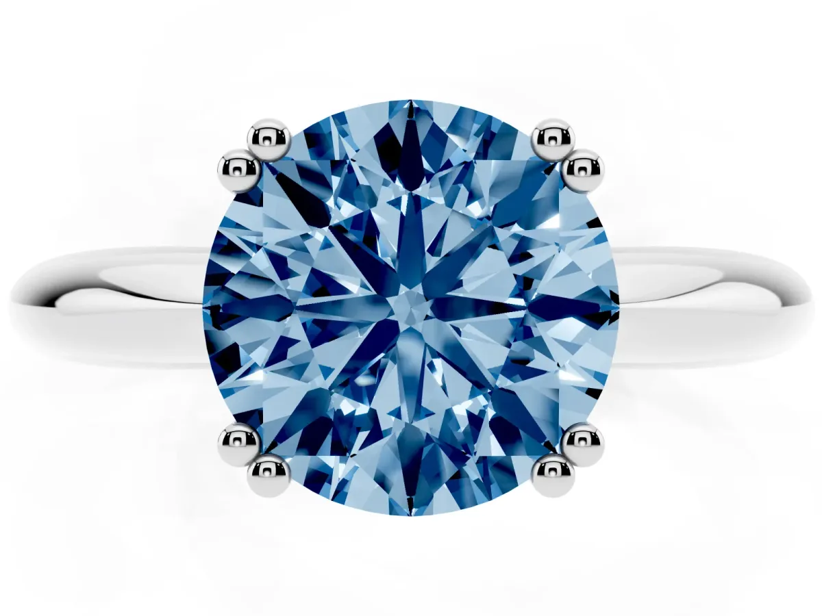 Fancy Blue Round Cut Cut Solitaire Engagement Ring with Tapered Band and Four-Prong Setting Silver