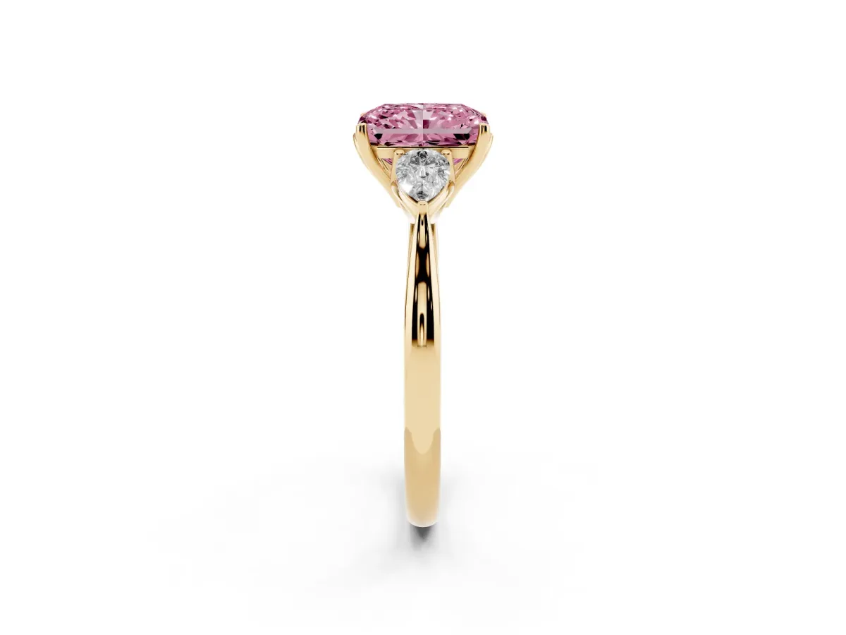 Fancy Pink Three-Stone Radiant Cut Diamond Ring with Pear Side Stones in Four-Prong Setting Yellow gold