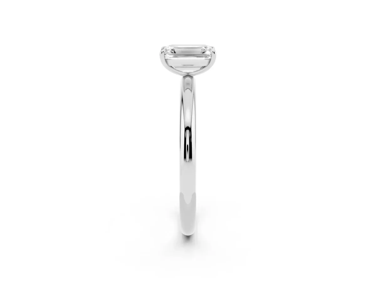 Emerald Cut Solitaire Diamond Ring with Four-Prong Setting on a Plain Band Platinum