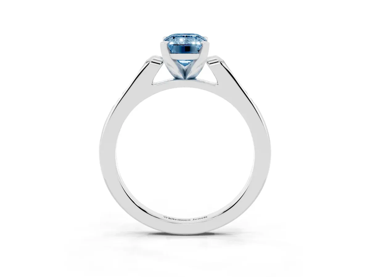 Fancy Blue Emerald Cut Diamond Solitaire Ring with Channel Set Round Band and Prong Setting Silver