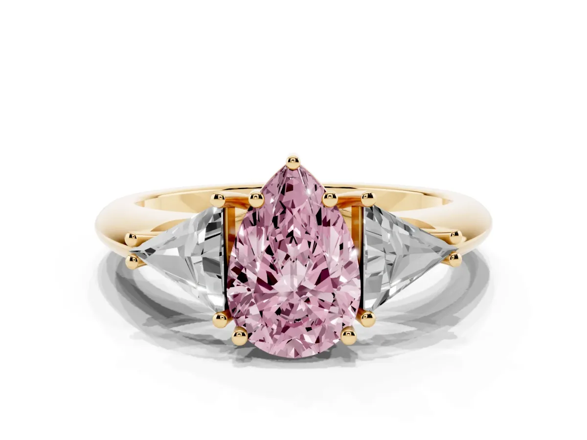 Fancy Pink Three-Stone Pear Cut Diamond Engagement Ring with Trillion Side Stones and Prong Setting Yellow gold