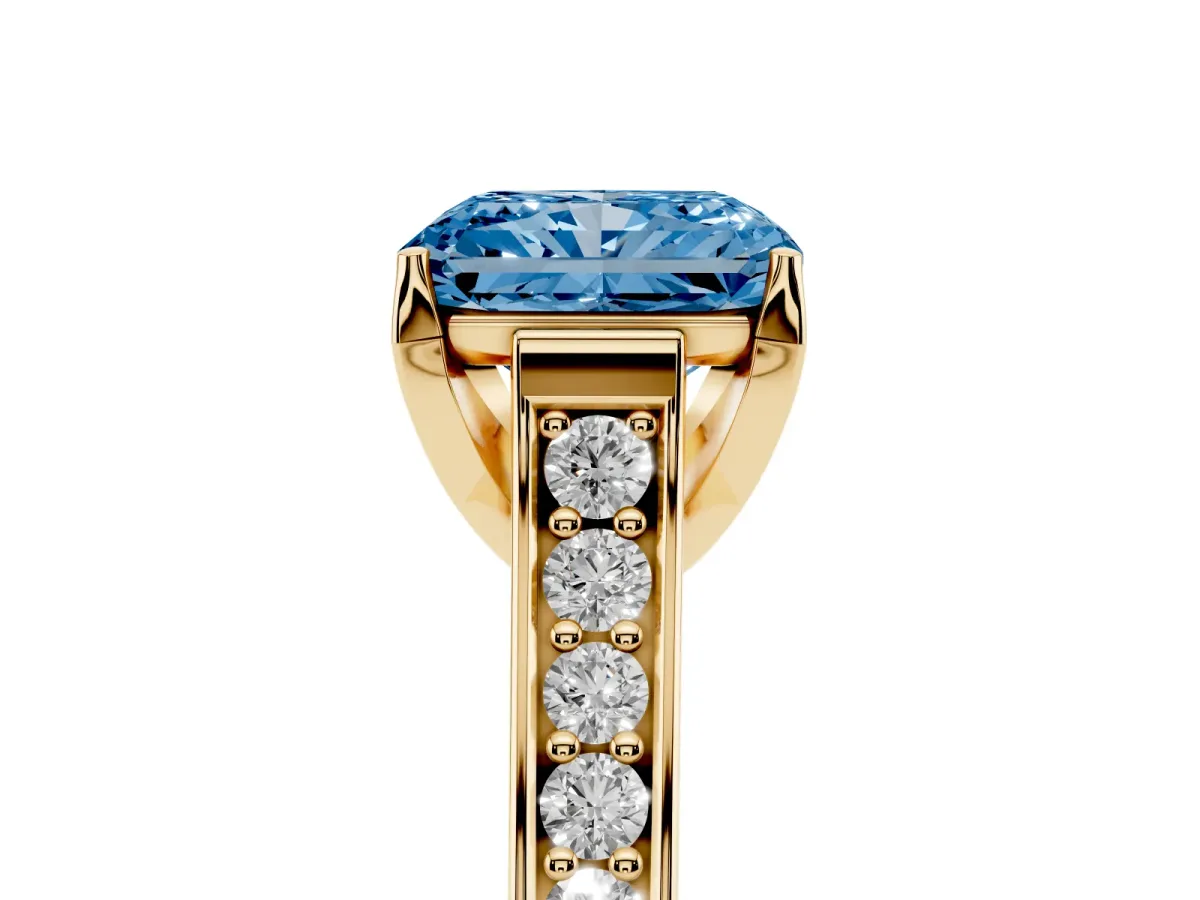 Fancy Blue Radiant Cut Brilliant Cut Diamond Engagement Ring with Pavé Band and Four-Prong Setting Yellow gold