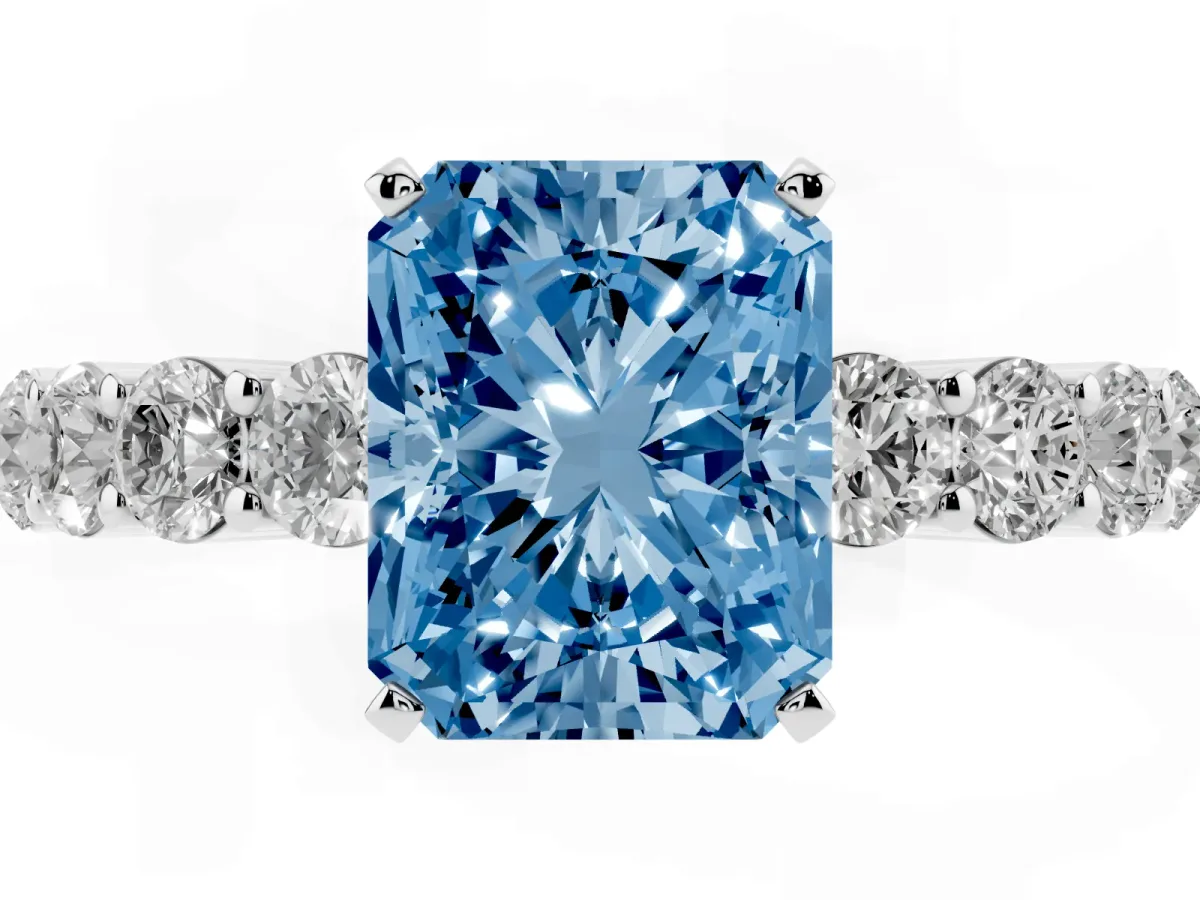 Fancy Blue Radiant Cut Diamond Solitaire Ring with Shared Prong Round Side Stones Platinum