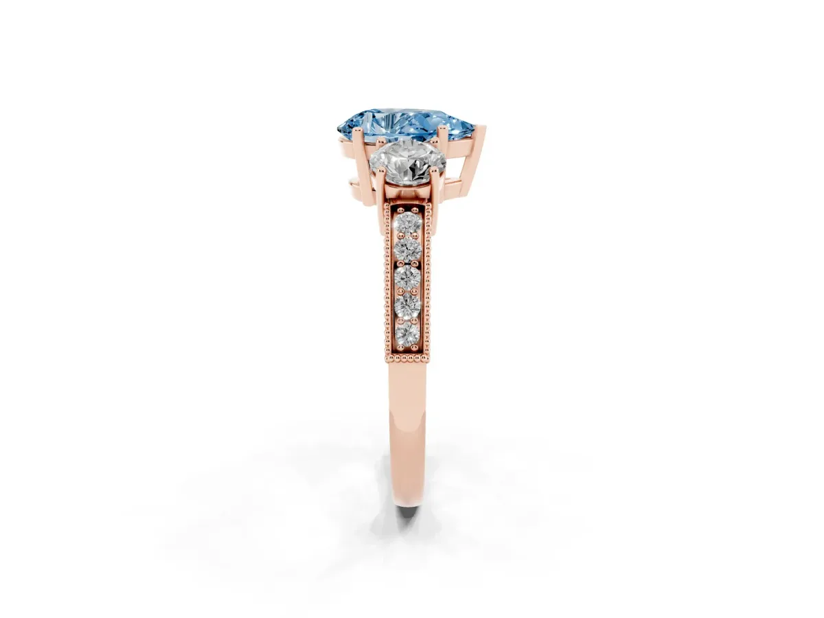 Fancy Blue Pear Cut Three-Stone Diamond Ring with Pavé Band and Four-Prong Setting Rose gold