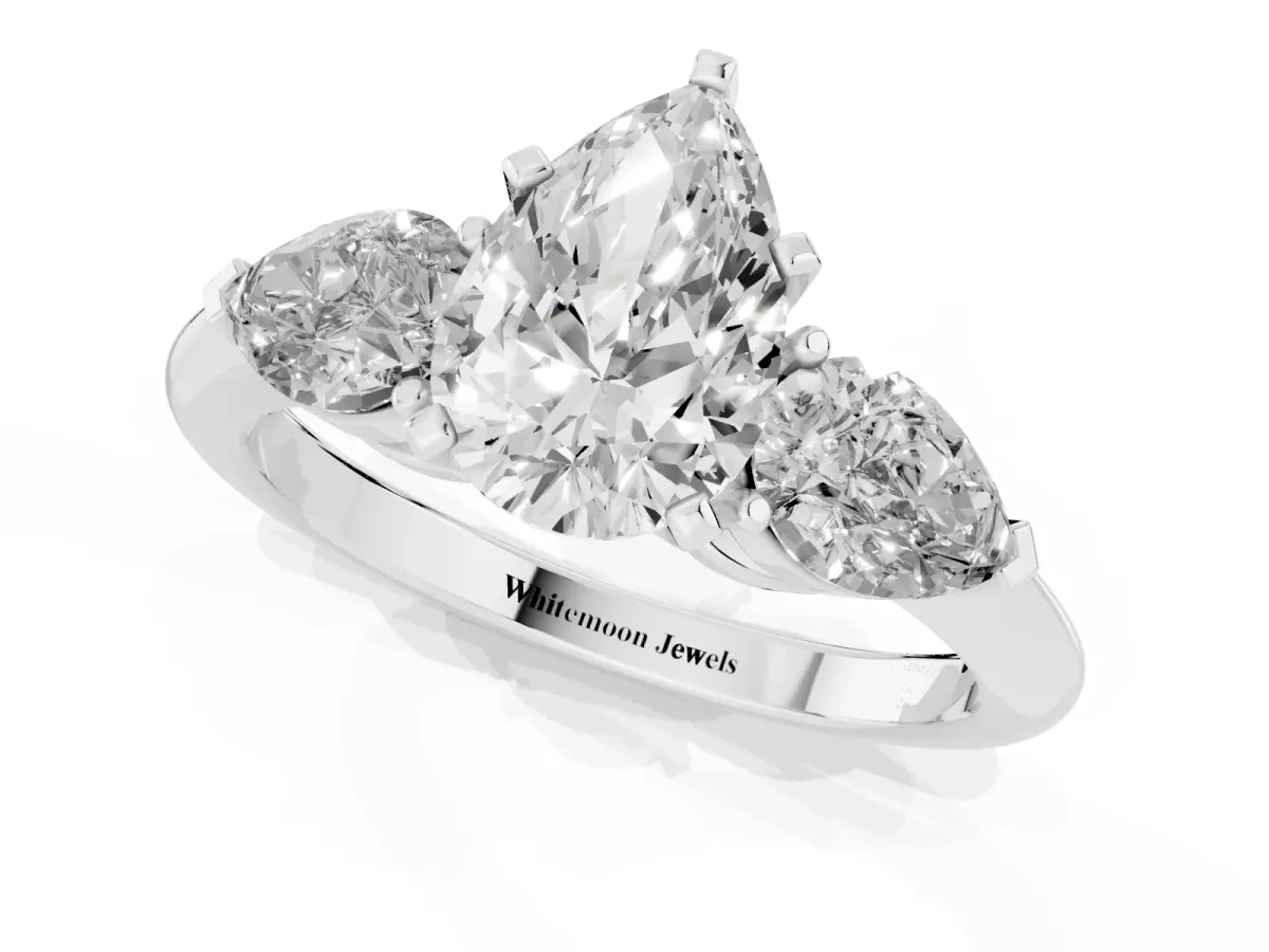 Three-Stone Pear Cut Diamond Ring with Pear Side Stones and Four-Prong Setting Silver