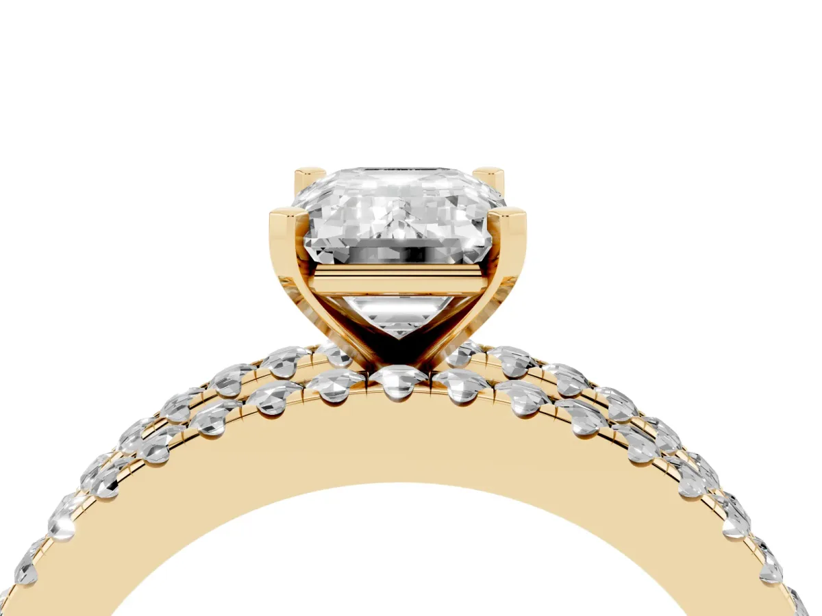 Emerald Cut Diamond Solitaire Ring with Pavé and Channel Set Band Yellow gold