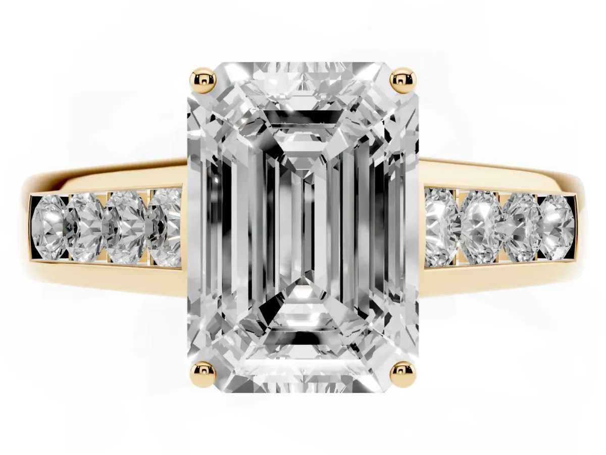 Emerald Cut Brilliant Channel-Set Solitaire Ring with Four-Prong Setting Yellow gold