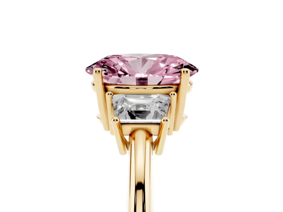 Fancy Pink Oval Cut Diamond Three-Stone Ring with Trapezoid Side Stones and Prong Setting Yellow gold