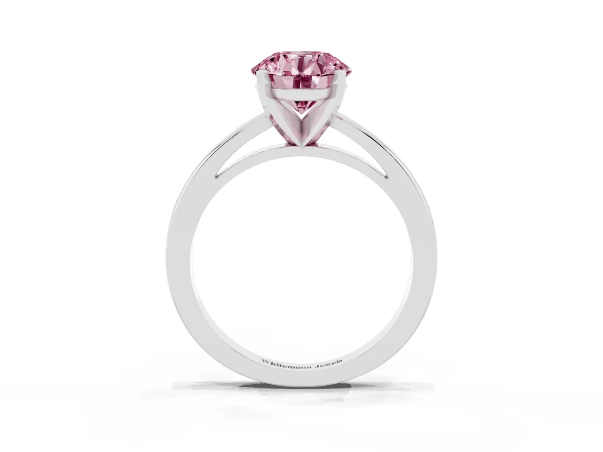 Fancy Pink Round Cut Solitaire Diamond Engagement Ring with Four-Prong Setting on a Classic Band Platinum