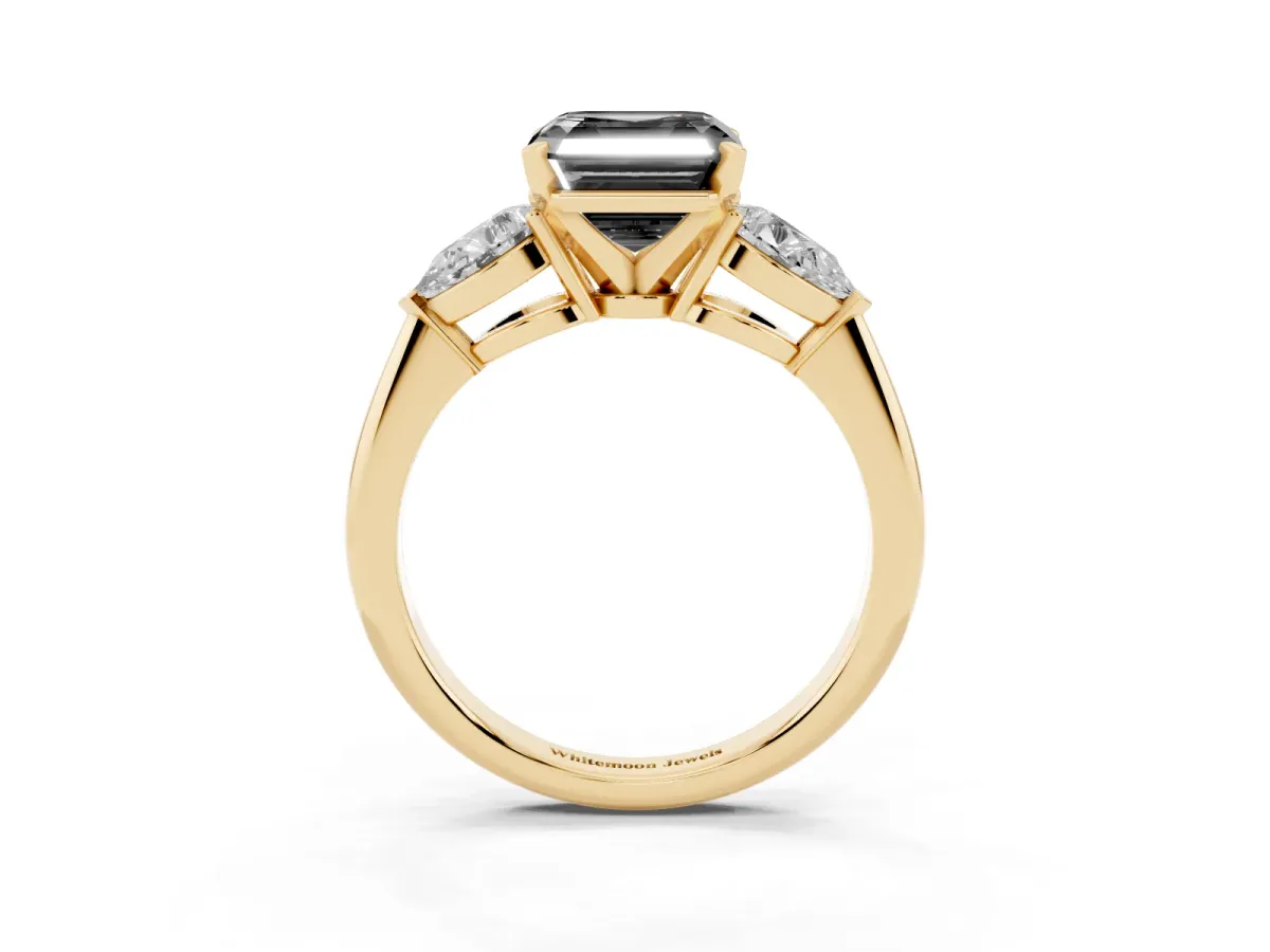 Fancy Black Three-Stone Asscher Cut Diamond Ring with Pear Side Stones and Four-Prong Setting Yellow gold