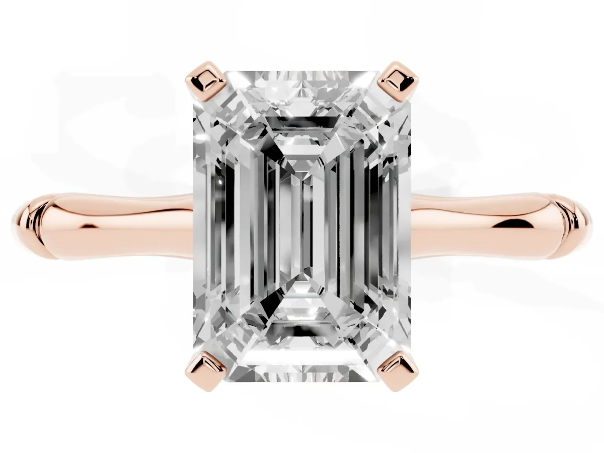 Emerald Cut Solitaire Diamond Ring with Bamboo Band and Four-Prong Setting Rose gold