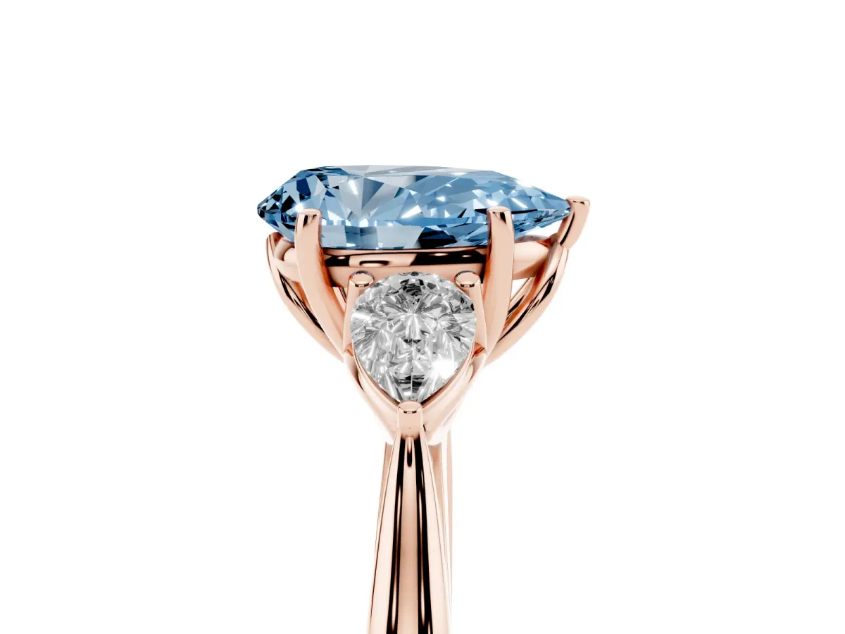 Fancy Blue Pear Cut Diamond Three-Stone Ring with Pear Side Stones and Prong Setting Rose gold