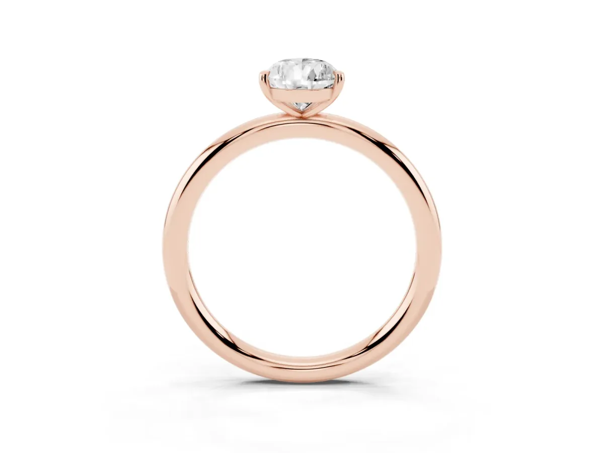 Pear Cut Solitaire Diamond Ring with Four-Prong Setting on a Plain Band Rose gold