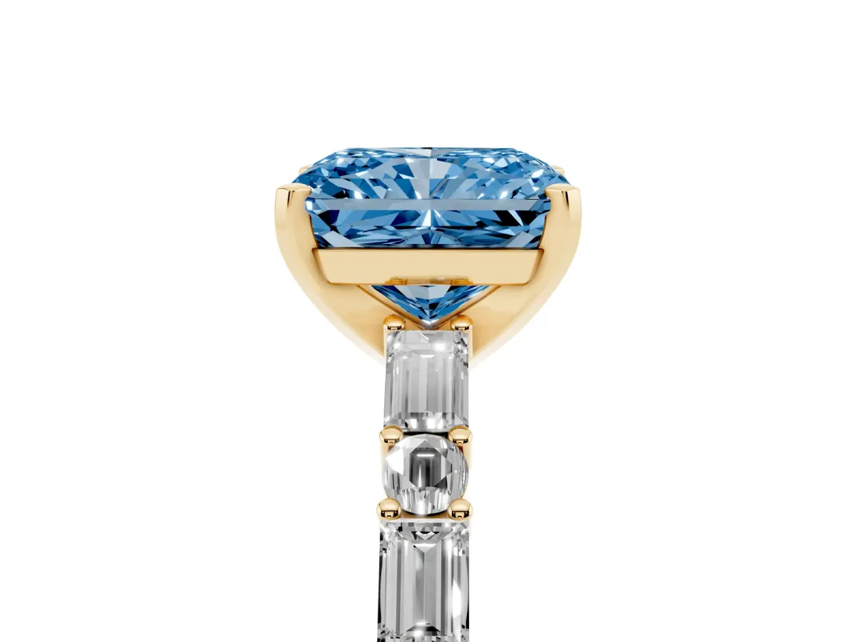 Fancy Blue Radiant Cut Diamond Solitaire with Side Baguettes and Channel Set Band Yellow gold
