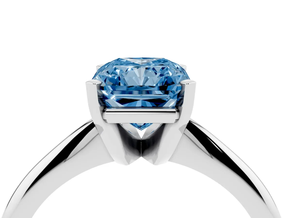 Fancy Blue Radiant Cut Cut Solitaire Ring with Four-Prong Setting on a Classic Band Silver